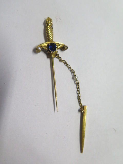 A collection of six tie pins including a sword, one pin marked 18ct, total weight with base metal - Image 2 of 4