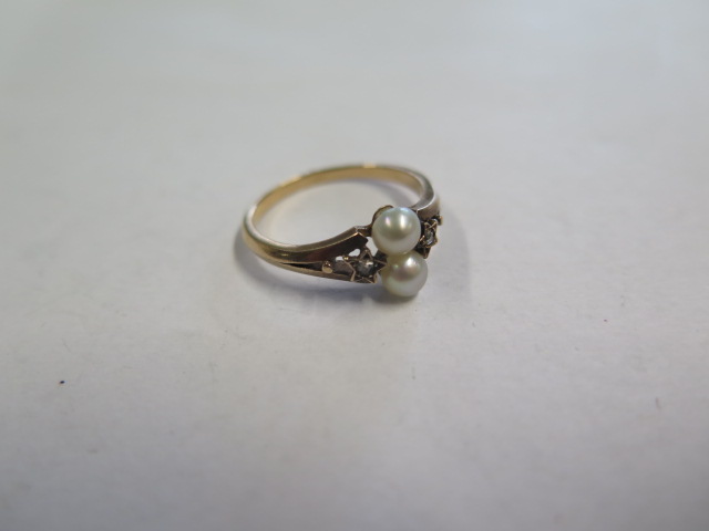 A French yellow gold pearl and diamond ring, tests to approx 18ct, ring size N, approx 2.5 grams,