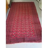 A hand knotted woollen Turkman rug, 2.7m x 1.6m, some small repairs but colours bright