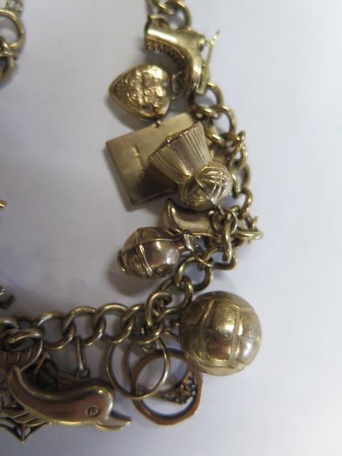 A 9ct gold charm bracelet with 20 assorted charms, bracelet approx 20cm long, total weight approx - Image 3 of 3