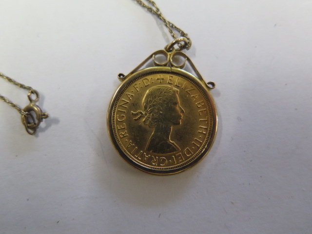 An Elizabeth II gold full sovereign, dated 1966, in a hallmarked 9ct gold pendant mount on a fine - Image 3 of 3