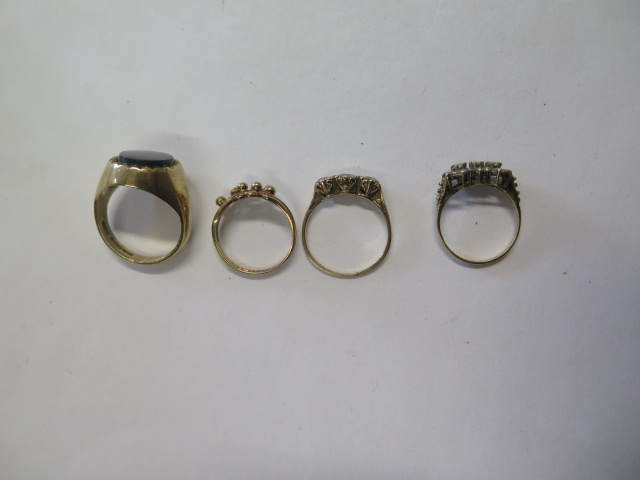 Four 9ct yellow gold rings, total weight approx 15.4 grams, one ring cut while others intact, - Image 2 of 2