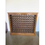 A burr oak 80 bottle wine rack made by a local craftsman to a high standard, 98cm tall x 111cm