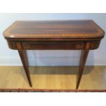 A Regency rosewood inlaid fold over card table in restored condition, 74cm tall x 92cm wide, 45cm