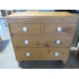 A 19th century pine chest with two short over two long drawers, 90cm wide x 86cm high