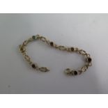 A 9ct yellow gold multi stone bracelet, 19cm long, approx 9.2 grams, generally good condition