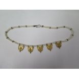 A string of eastern pearls with 5 gilt metal drops, 42cm long