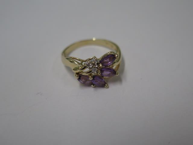A pretty 14ct yellow gold Amethyst and diamond floral spray ring, size O, marked 14K, approx 3