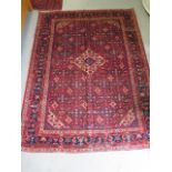 A hand knotted woollen Hamadan rug, 2.16m x 1.51m, in good condition