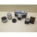 A Voigtlander Vitessa T Rangefinder 35mm camera complete with 35mm,50mm,100mm lenses and a Turnit