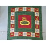 A Burberrys silk scarf, c.1980, detailed with classic check and equestrian knight against a green