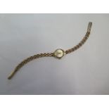 A ladies hallmarked 9ct yellow gold bracelet quartz wristwatch weight of watch without movement 6.