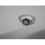 A platinum (950) sapphire and diamond cluster ring, size N/O, head approx 7mm, approx 3.3 grams,