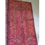 A hand knotted woollen Hamadam rug, 2m x 1.12m, in good condition