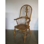 A Victorian style hoop back ash and elm elbow chair, 122cm tall x 64cm wide