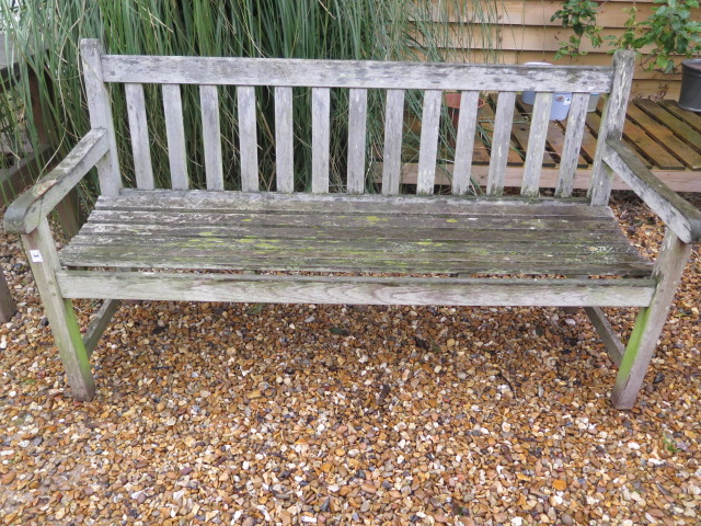 A garden bench in sound condition, 152cm wide