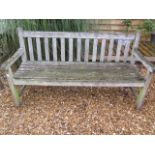 A garden bench in sound condition, 152cm wide