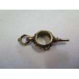 A gold and steel watch key fob, 4cm long, approx 9ct, approx 7.3 grams, generally good