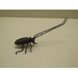 A bronze insect, 14cm long, in good condition