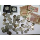 A collection of assorted banknotes and coinage