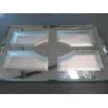An art deco mirrored glass serving tray of rectangular form with chamfered edges and four frosted