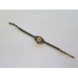 A 9ct yellow gold ladies manual wind wristwatch, strap marked 9ct, not running, approx 11 grams