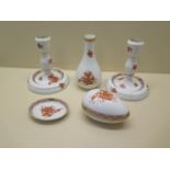 A pair of Herend china candlesticks, 15cm tall, and three other pieces, all good condition