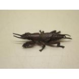 A bronze insect, 7cm long, in good condition