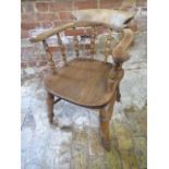 A Victorian ash and elm smokers bow armchair, 79cm tall x 61cm wide, in sturdy condition