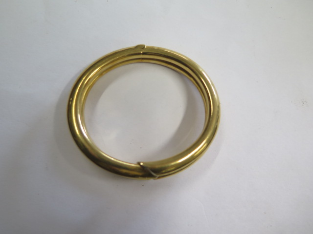 A sprung hinged 18ct hollow yellow gold bangle set with 4 small diamonds marked 750, 7.5cm x 6. - Image 2 of 4