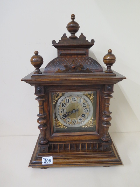 A Junghams walnut mantle clock striking on a single coil gong, 45cm tall, in running order and - Image 2 of 3