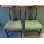 A pair of Georgian mahogany side chairs with re-upholstered seats, 94cm tall, in generally good