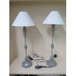 A pair of metal painted table lamps with shades, 74cm tall