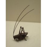 A bronze insect, 9cm long, in good condition