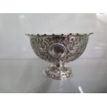 A good silver gilt bowl by Charles Stuart Harris, London 1883, having elaborate bird and flower