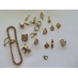 A 9ct gold bracelet and a collection of charms, total approx weight 30.7 grams