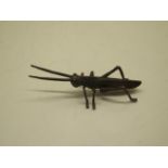 A bronze insect, 12cm long, in good condition