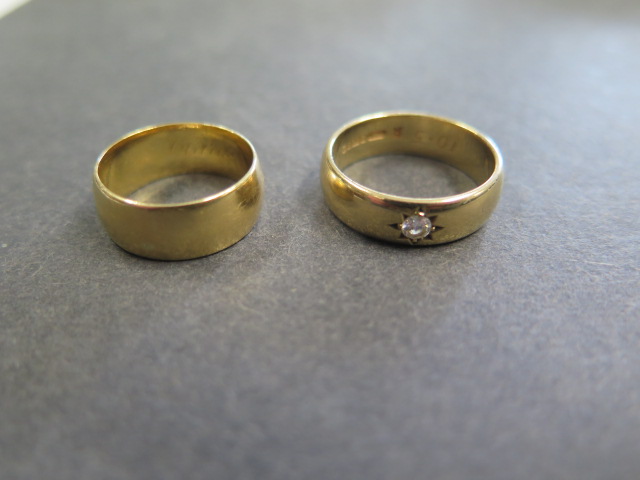 An 18ct gold hallmarked band ring, size L, approx 5.7 grams and a 9ct gold hallmarked band ring