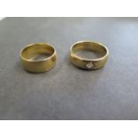 An 18ct gold hallmarked band ring, size L, approx 5.7 grams and a 9ct gold hallmarked band ring