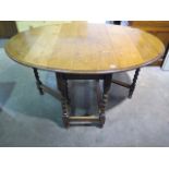 An oak 1930's barley twist dropleaf table, 72cm tall x 102cm x 136cm when extended