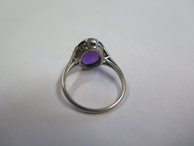 A platinum amethyst ring, amethyst approx 11.5mm x 10mm x 6mm, set with small diamonds to the - Image 3 of 3