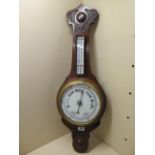 A 1930's aneroid oak case barometer, 76cm tall, polished condition, appears to be working fine
