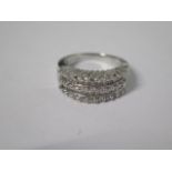 A 14ct white gold five band diamond ring, consisting of brilliant cut and princess cut diamonds,