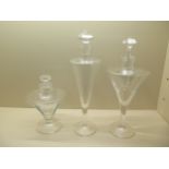 Three clear glass tall chemist type scent bottles with stoppers, tallest 48cm, all in good condition