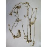 A collection of assorted 9ct gold chains and pendants, some broken and tangled, total weight