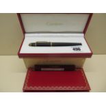 A Cartier ballpoint pen cased with repair guarantee and outer card case, pen 14.3cm, outer card case