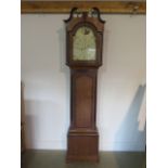 An oak and mahogany 8 day striking clock, 82" tall, with a painted 12" dial in restored condition,