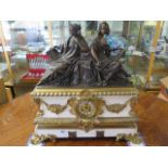 A 19th century patinated bronze ormolu and marble figural mantel clock surmounted with classical