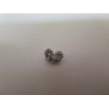 A pair of 14ct white gold diamond stud earrings, approx 0.16ct each, white gold backs, in good