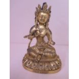 A gilt bronze buddha, 20cm tall